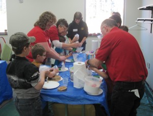 Norb and Barb Yogerst show participants in the wildlife session how to make animal tracks